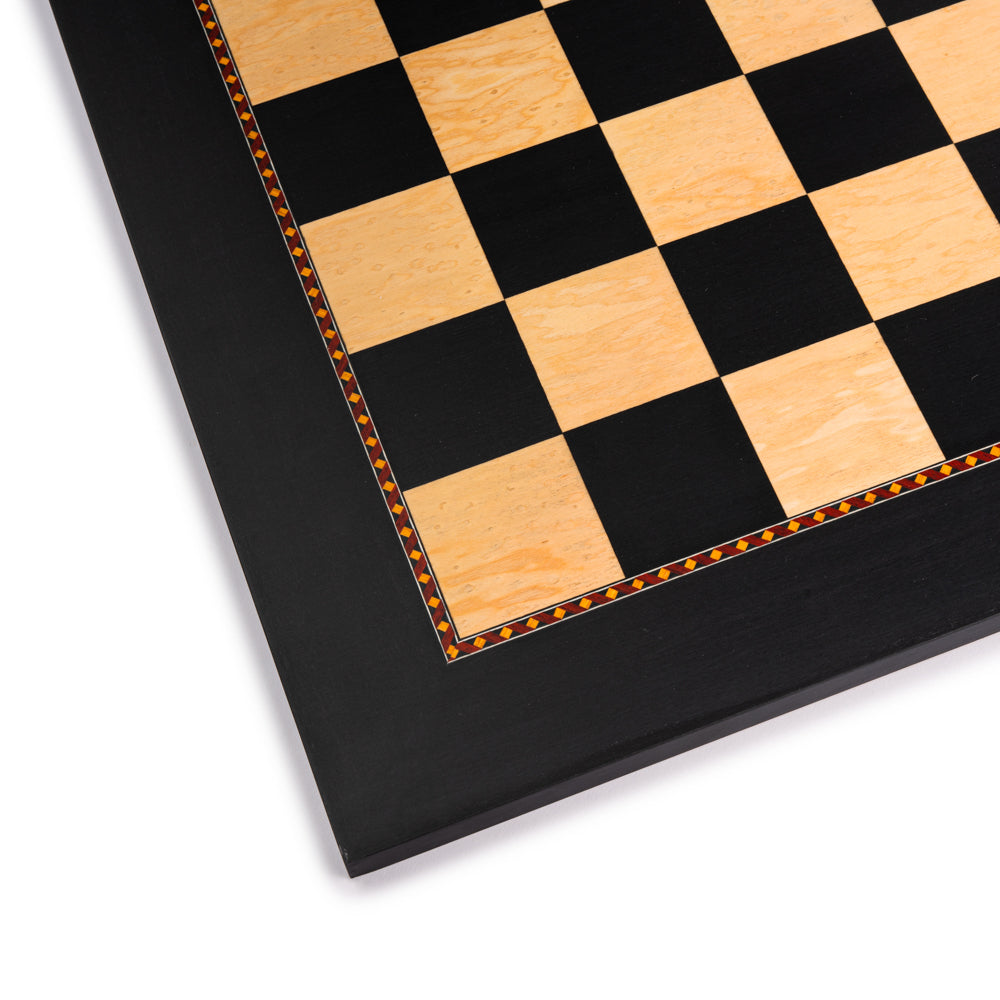 The Queen's Gambit Black Dyed Poplar and Ash Root Chess Board close-up with 1.96 inch squares crafted by Rechapados Ferrer in Spain.