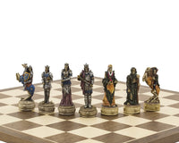 Zombie-themed hand-painted Italfama chess pieces on a chessboard, featuring ornate skeletal designs with blue, purple, and rustic hues.