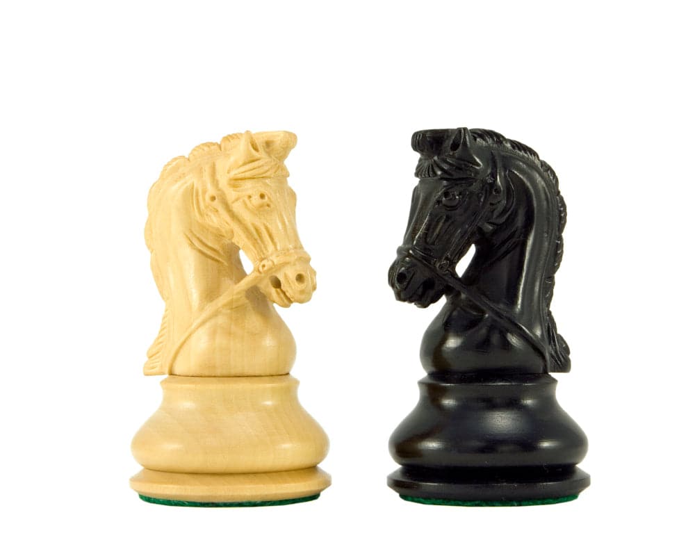 Ebony and boxwood bridled knights from Monarch Series luxury chess set, showcasing supreme quality and detailed craftsmanship.