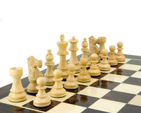 Luxurious French Knight Series Staunton chess pieces in rosewood on a chessboard. Weighted and felted 3.25-inch king, ideal for an 18-inch board.