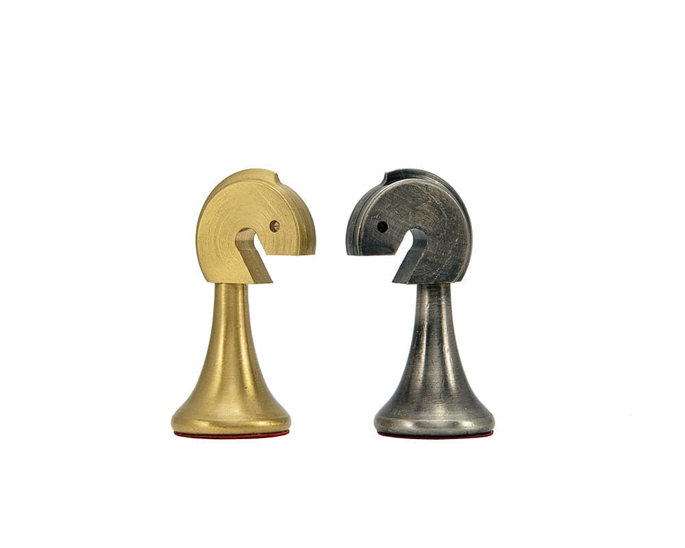 Brass and nickel knight chess pieces from the Metropolis Series, hand turned by Italian craftsmen with a minimalist design and perfect balance.