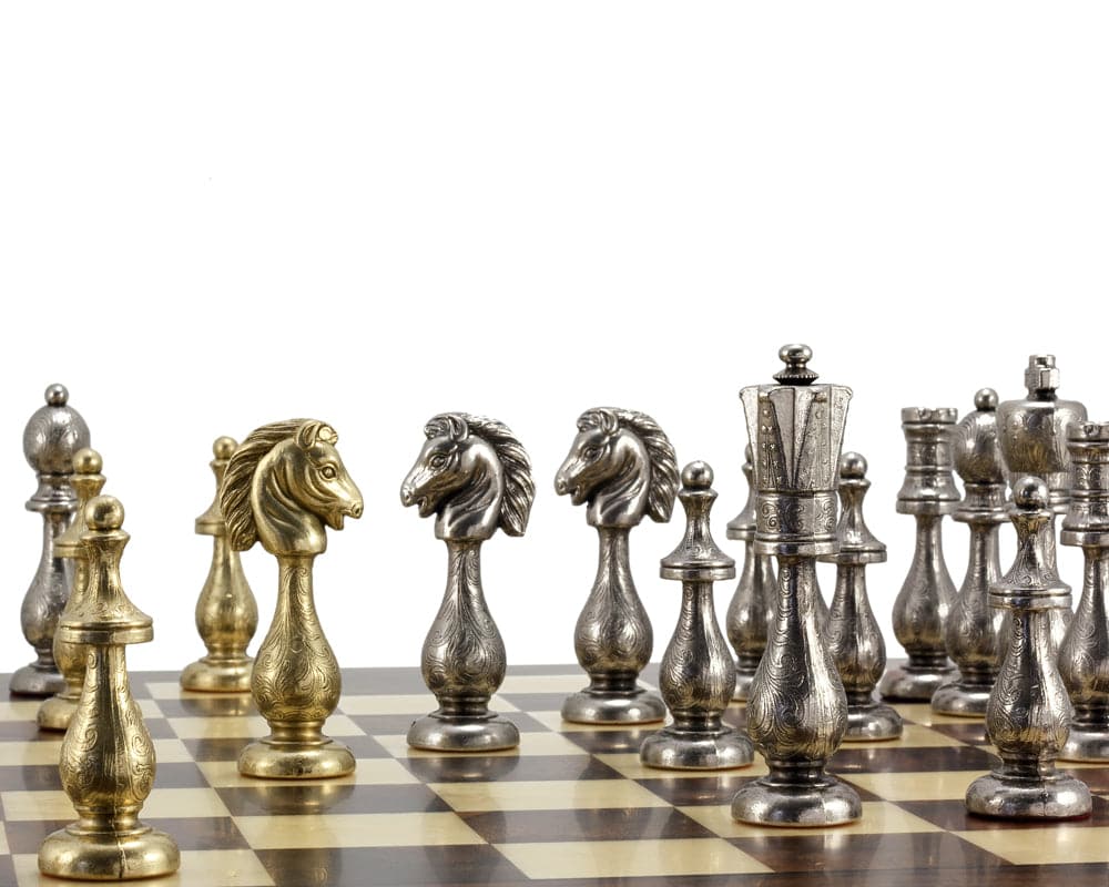 Maghreb brass and nickel chess pieces with intricate filigree detail on a 19" board, crafted in Italy, featuring a 4-inch king.