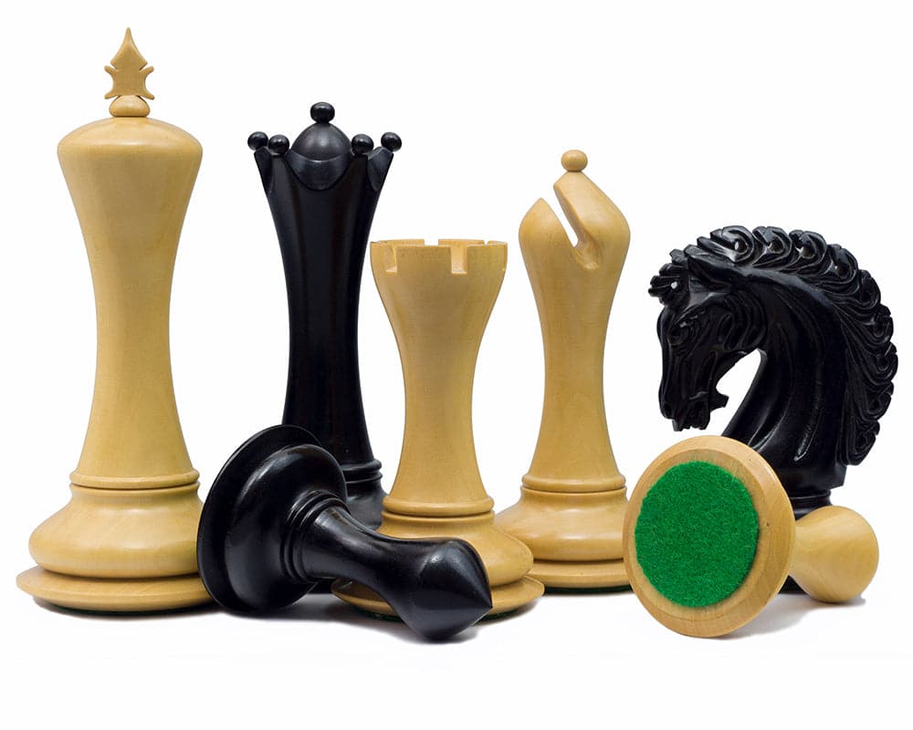 Empire Knight Ebony Chessmen with elaborately handcrafted pieces including 4.5-inch king and additional queens on white background