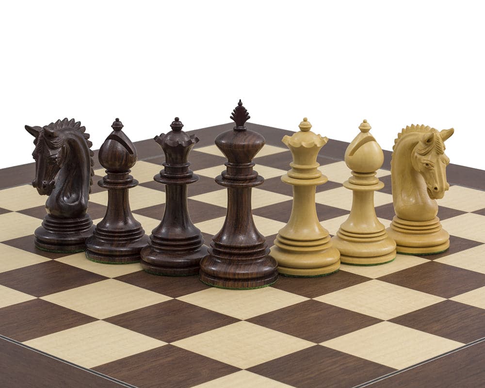 The Lemington Rosewood Chessmen 4.25 inch set on chessboard, featuring expertly handcrafted pieces with superb ornate detail and weighted bases.