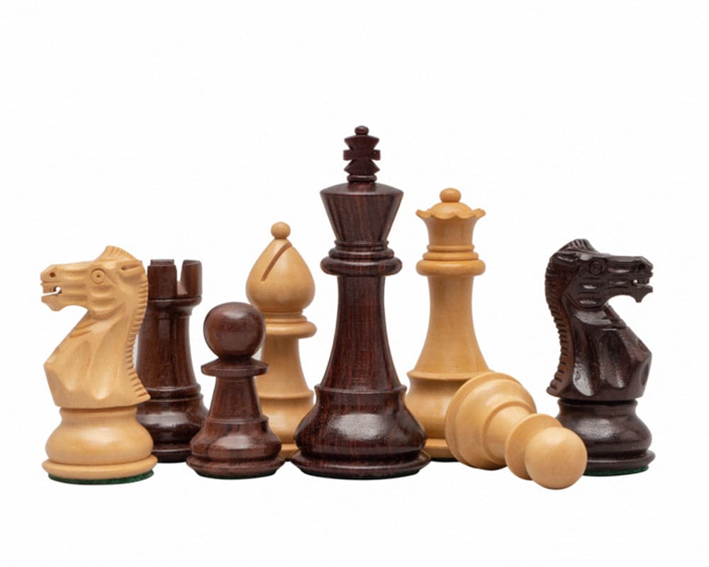 Classic Staunton Rosewood chessmen set featuring a 3.5 inch king, turned from Rosewood and boxwood, weighted and felted, with two additional queens.