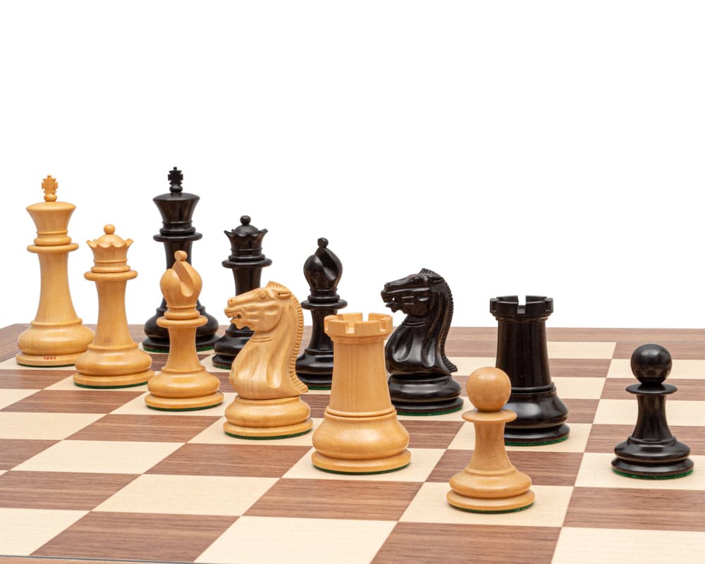 1851 Reproduction Staunton Ebony Chessmen 4.4 inch pieces on chess board with broad bases and superb detail crafted from ebony and boxwood.