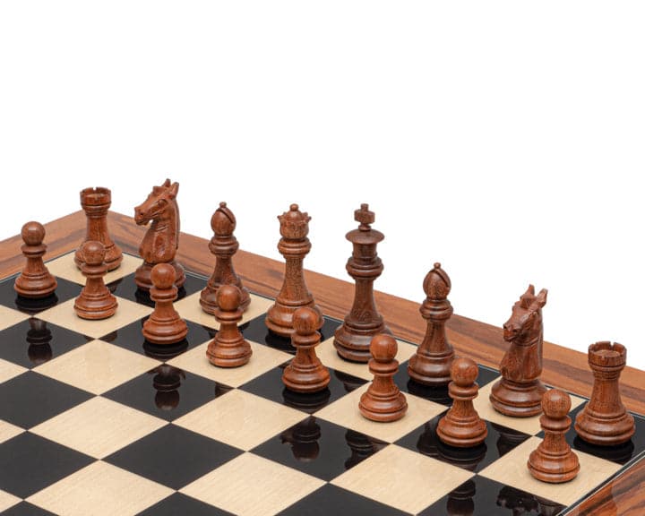 Golden Rosewood Italian Staunton chess pieces on black and white chessboard