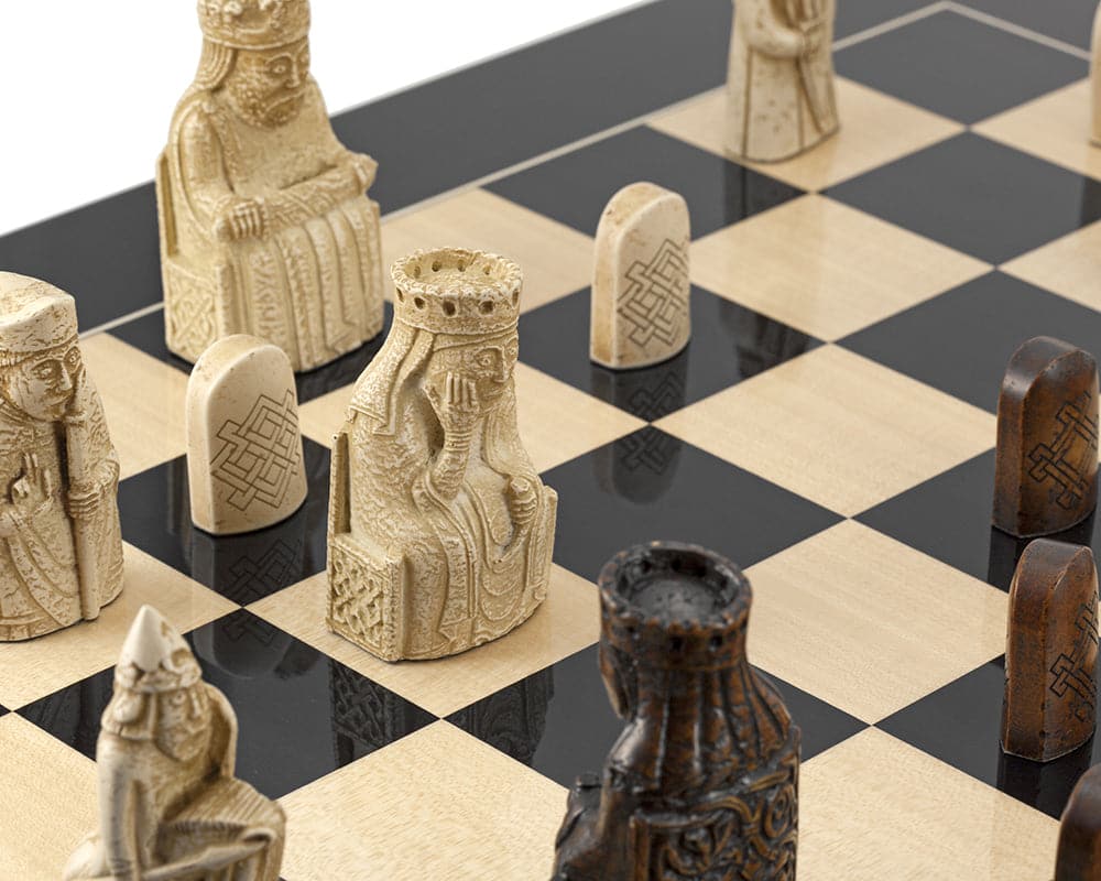 Isle of Lewis black gloss chess set with intricate chess pieces on a black anegre board