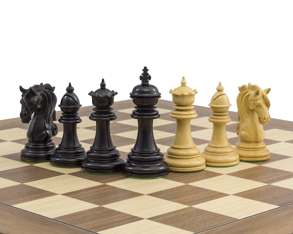 The Kingsgate Ebony and Walnut Chess Set with ornate chessmen on a deluxe walnut and maple board by Regency Chess Company.