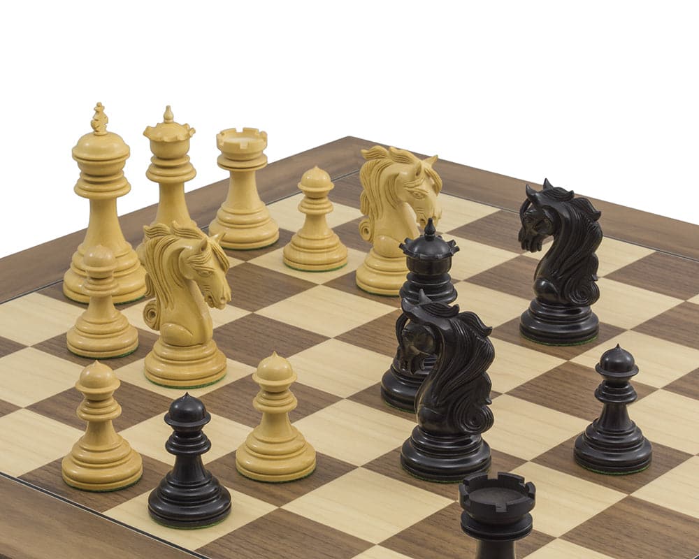 The Kingsgate Ebony and Walnut Chess Set with 4.25 inch king and ornate chessmen on deluxe walnut and maple board.