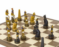 The Ancient Egypt hand painted themed chess set by Italfama on a walnut and maple board, featuring intricately crafted Egyptian characters.