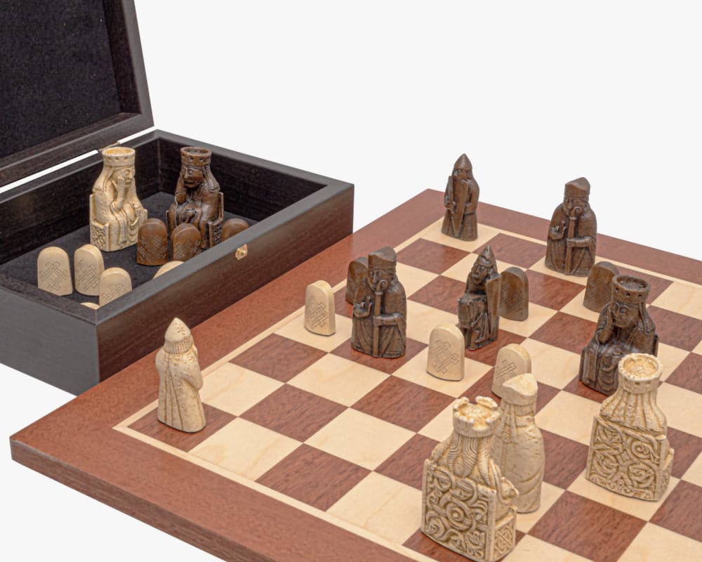 The Regency Isle of Lewis and Mahogany Chess Set with detailed chessmen on leatherette board and storage box.