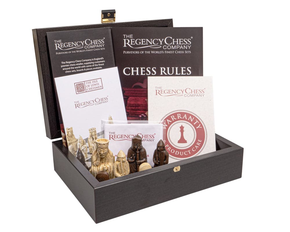 Regency Isle of Lewis and Mahogany Chess Set with chessmen, rules, and warranty in open chess cabinet box