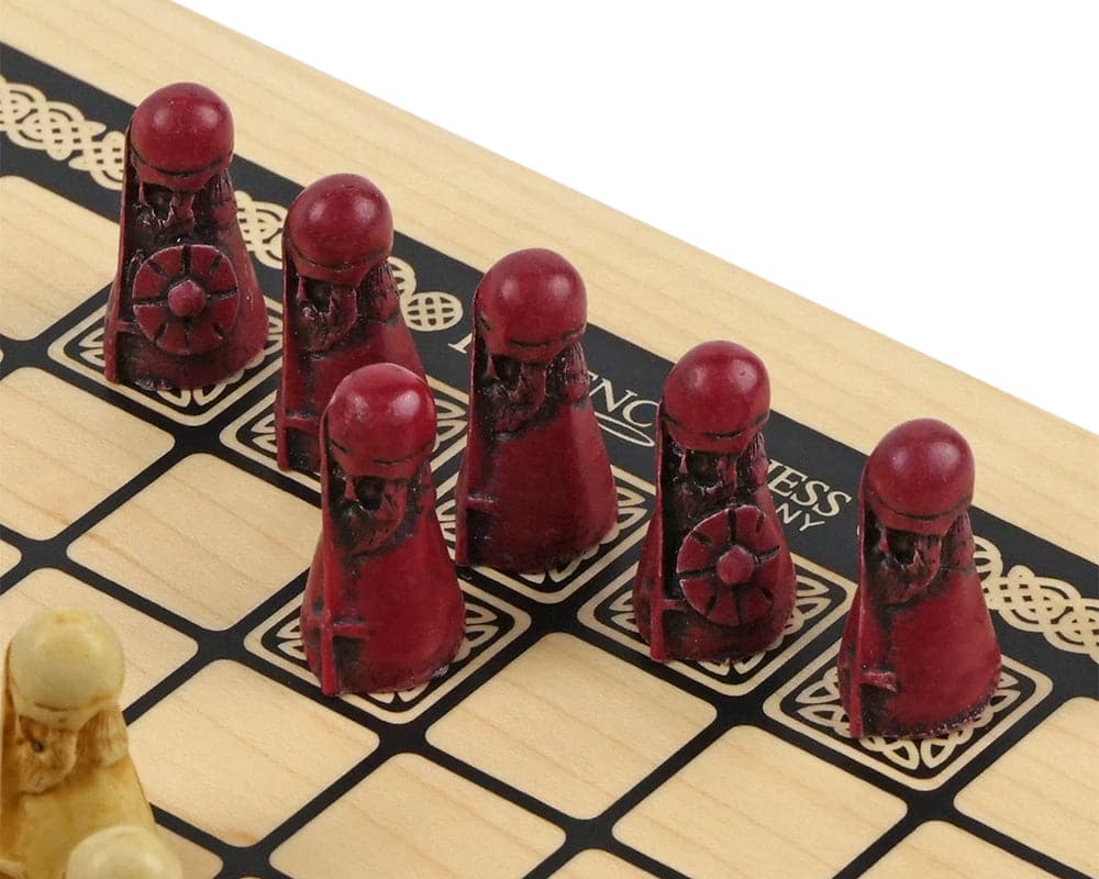 Viking-themed strategy board game with red game pieces on a wooden grid board.